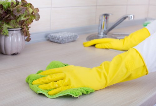 Staff handling carpet cleaning tools with correct posture and care