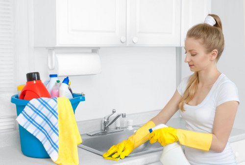 Cleaner setting up equipment before a carpet cleaning appointment